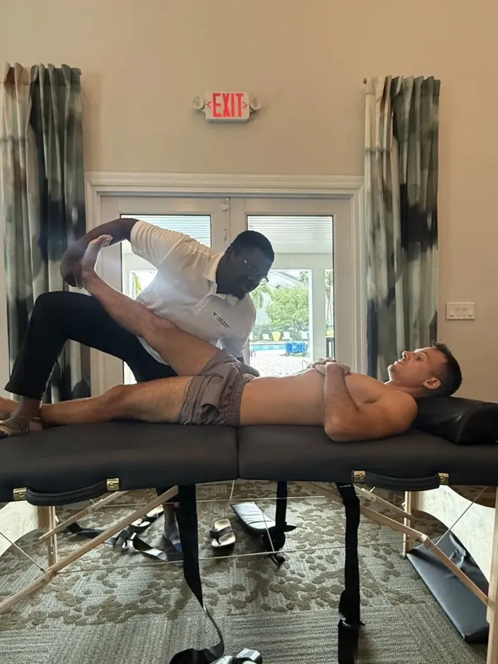 A participant receiving a deep leg stretch