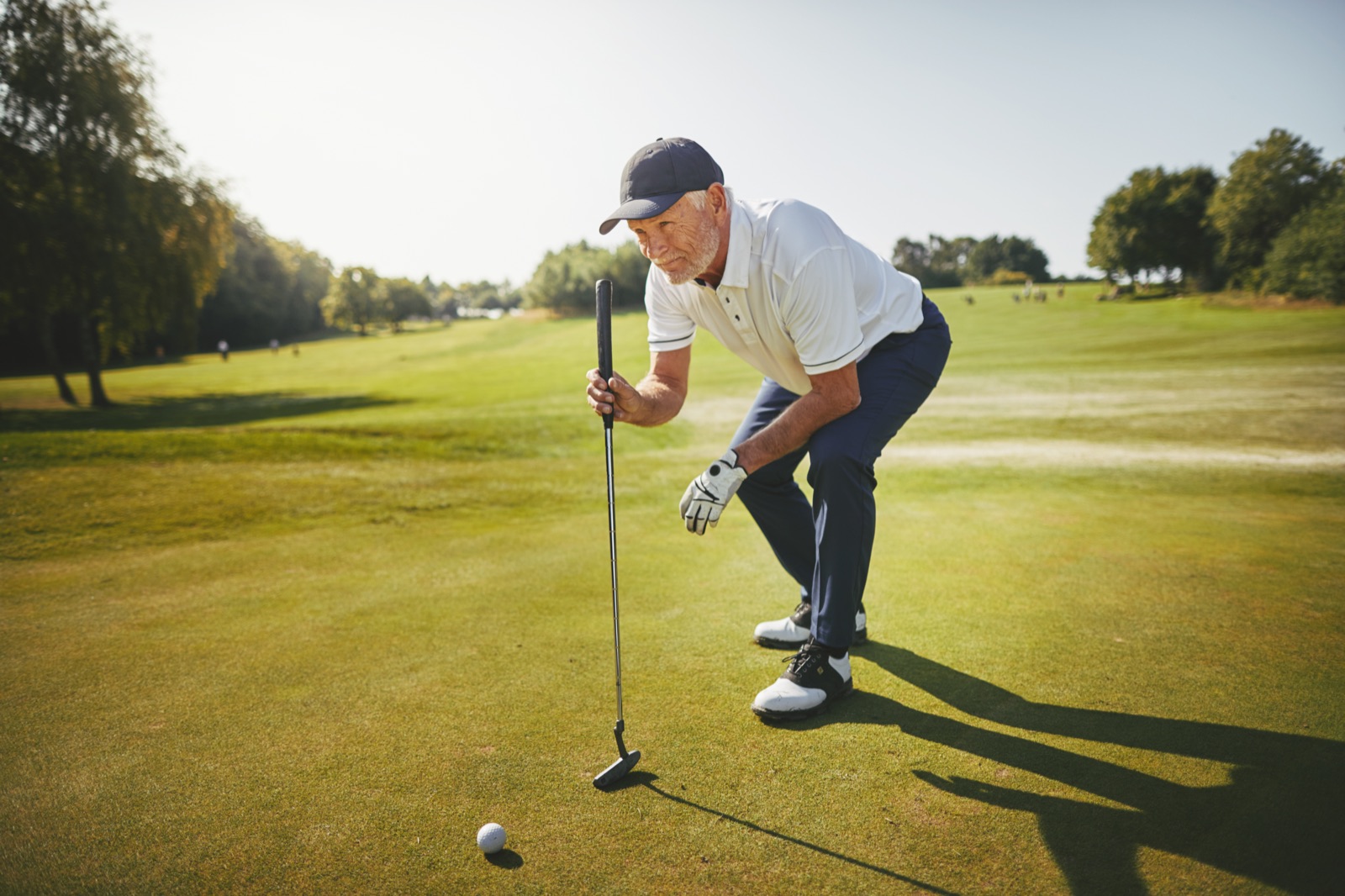 An active older adult enjoying a day on the golf course
